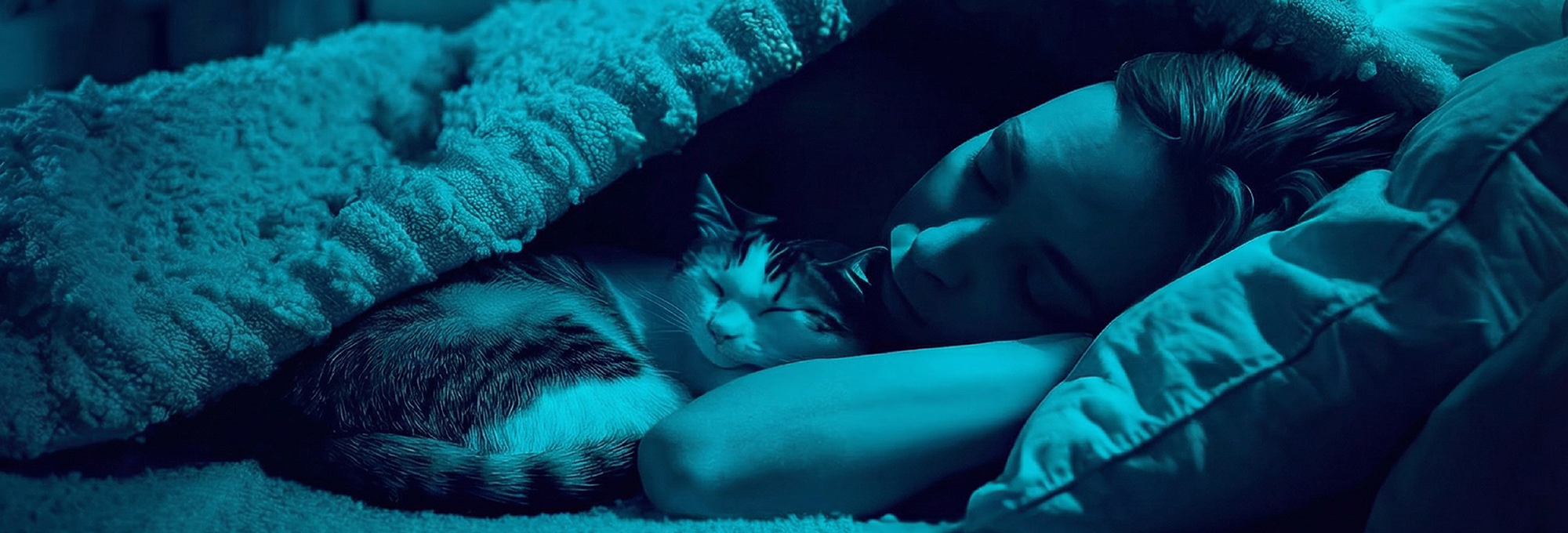 Woman sleeping with cat