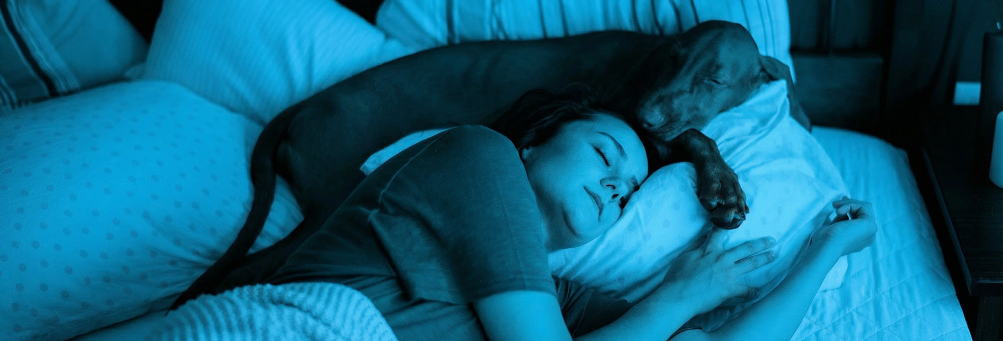 Woman Sleeping with Dog