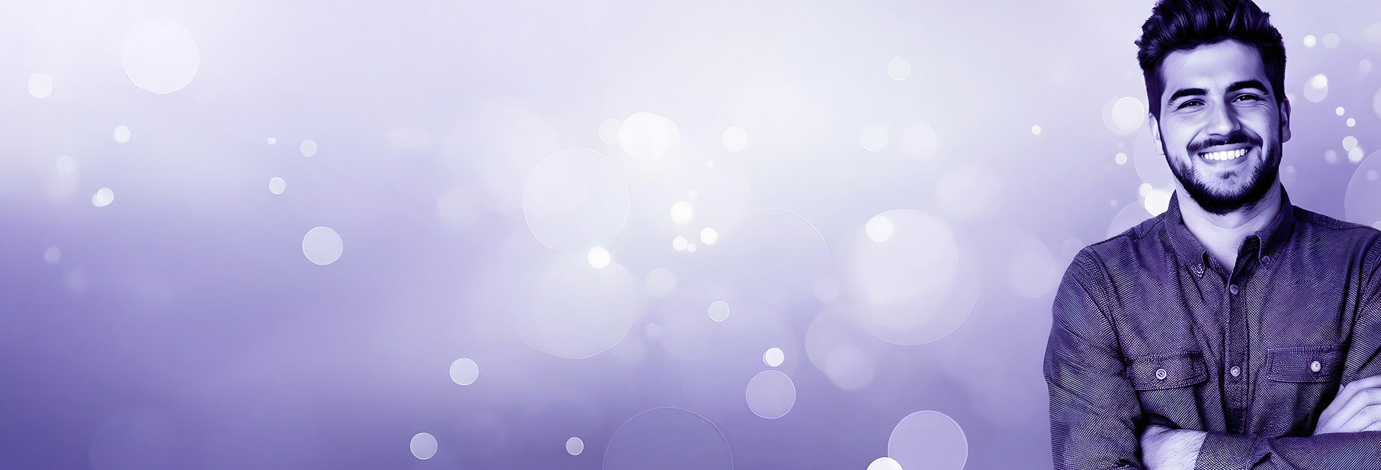 A smiling man in a purple color wash, representing the focus and clarity associated with CBG.