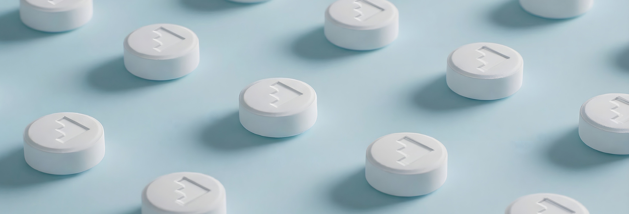 White tablets on a blue background