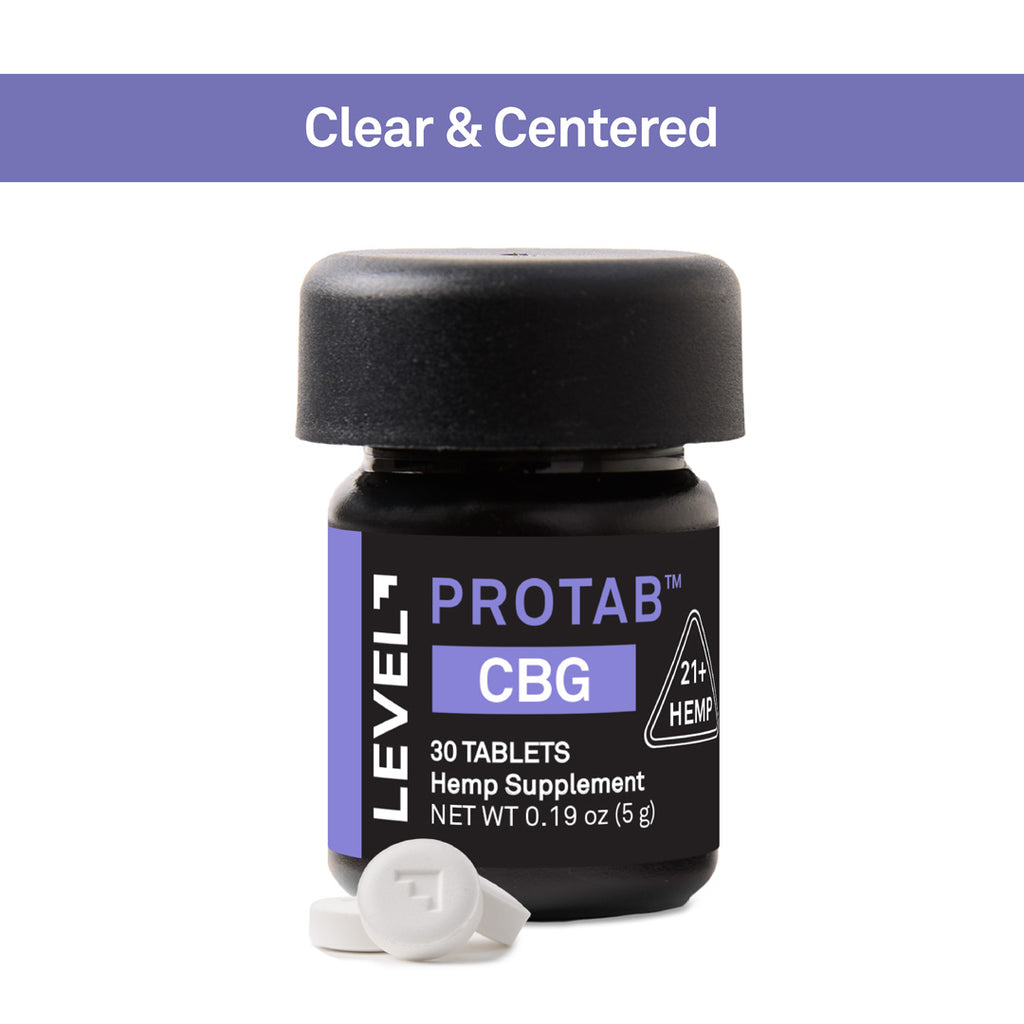 A small black bottle of Level 7 Protab CBG hemp supplement with a black cap, shown on a white background with a purple banner at the top reading 'Clear & Centered' and two white tablets in front.
