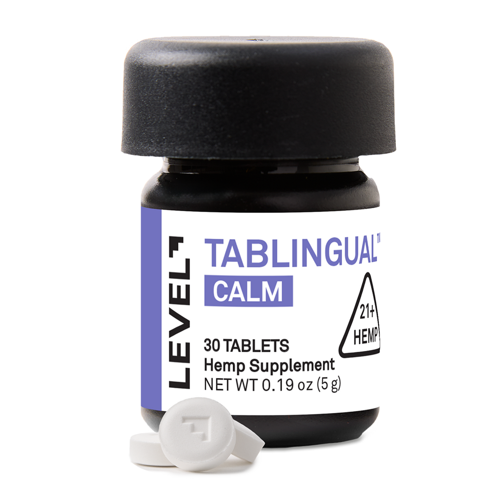Hemp supplement container labeled 'Tablingual Calm' with tablets on a white background